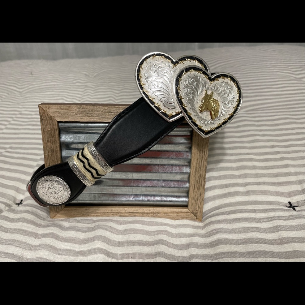 Womens Tony Lama belt with Montana Silversmiths buckle; size 32